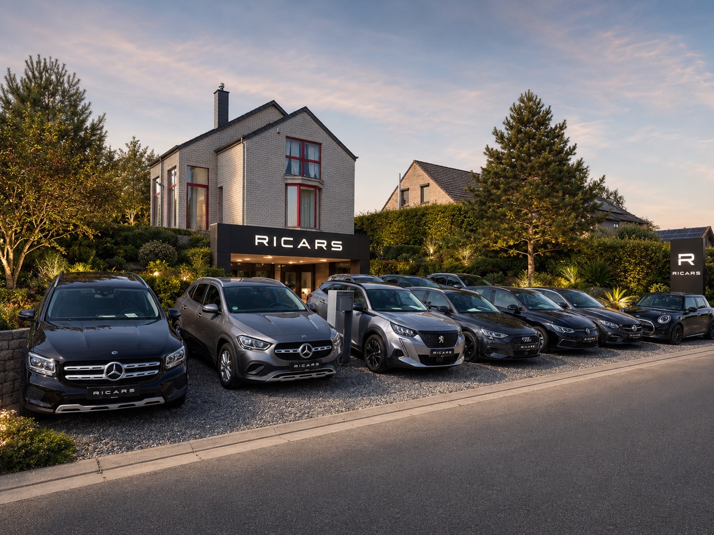 Showroom RICARS à Hannut — façade, enseigne et stock de véhicules